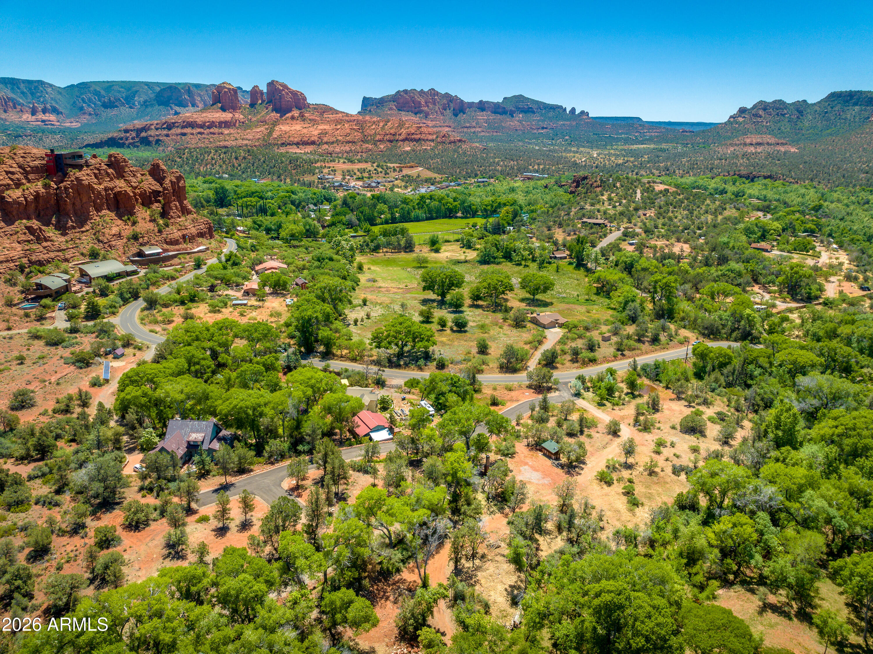 3155 Red Rock Loop Road, Unit 1 Sedona, AZ 86336 - Photo 5 of 18 a view of a lush green hillside and houses