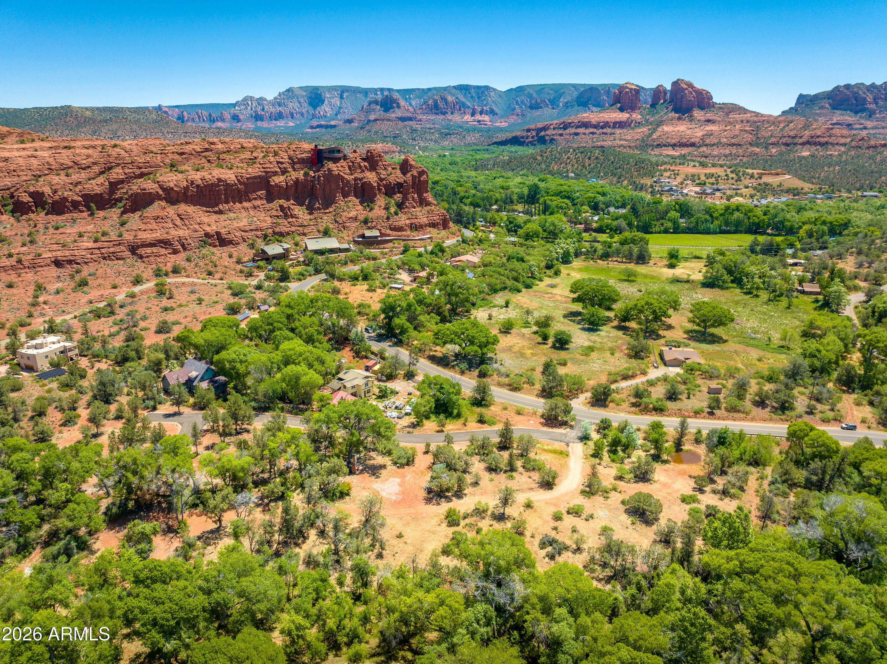 3155 Red Rock Loop Road, Unit 1 Sedona, AZ 86336 - Photo 6 of 18 an aerial view of residential houses with outdoor space and trees