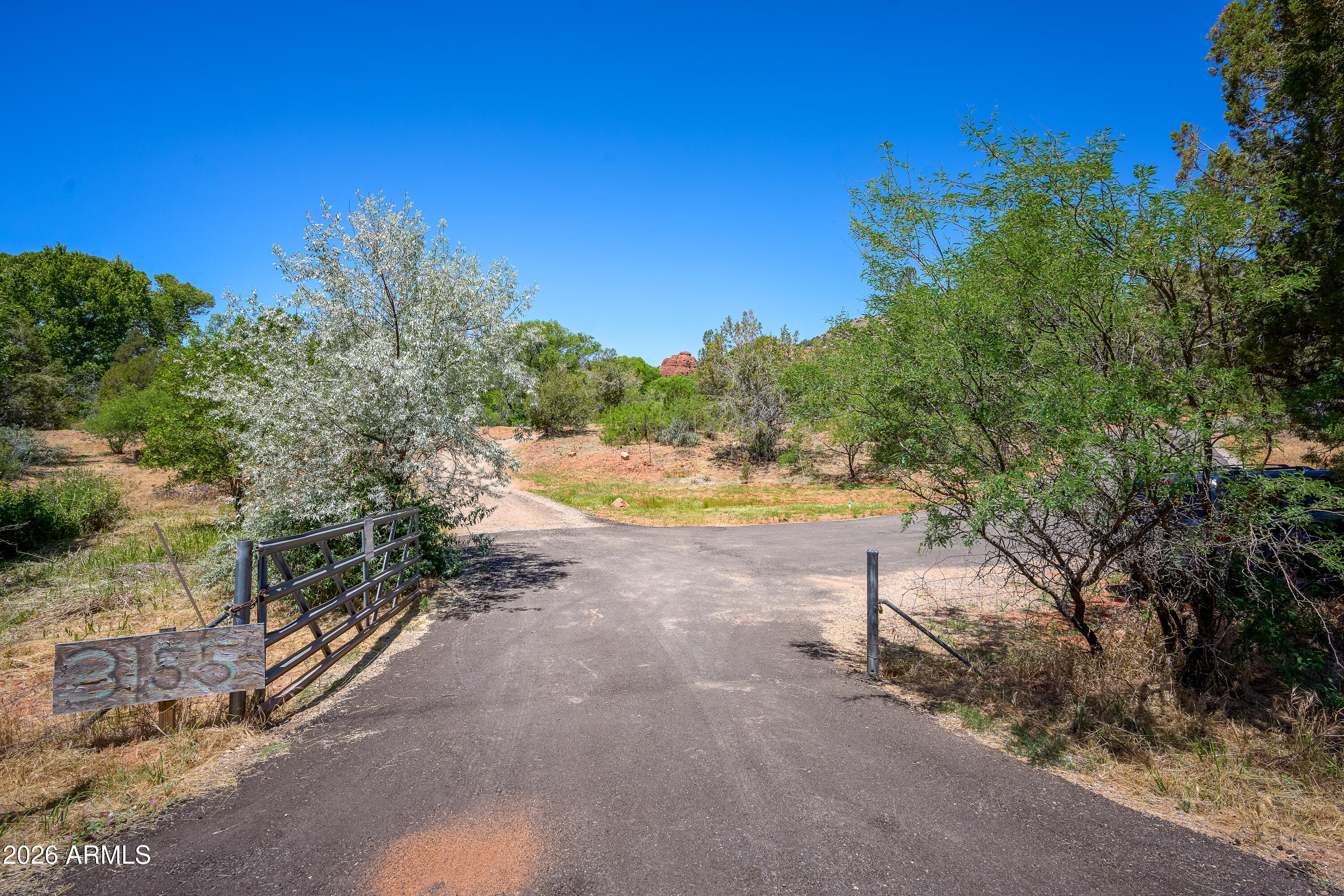 3155 Red Rock Loop Road, Unit 1 Sedona, AZ 86336 - Photo 9 of 18 a view of a swimming pool with an outdoor space and seating area