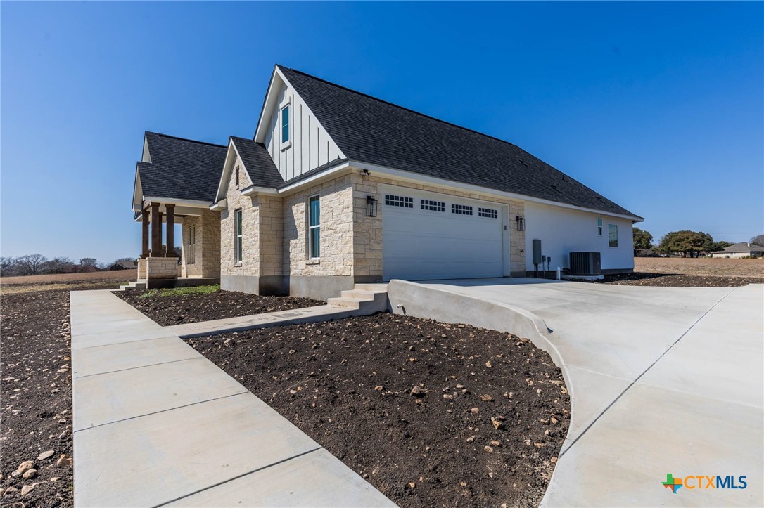 110 Lake Village Road Seguin, TX 78155 - Photo 4 of 38 a front view of a house with a yard