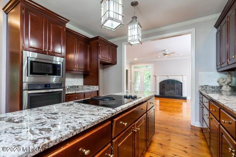 113 Hampton Ridge Road Macon, GA 31220 - Photo 12 of 29 a kitchen with stainless steel appliances granite countertop a sink stove and refrigerator