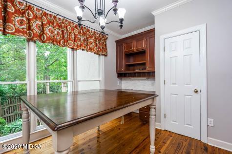 113 Hampton Ridge Road Macon, GA 31220 - Photo 14 of 29 a kitchen with stainless steel appliances granite countertop a refrigerator a stove and a wooden floors