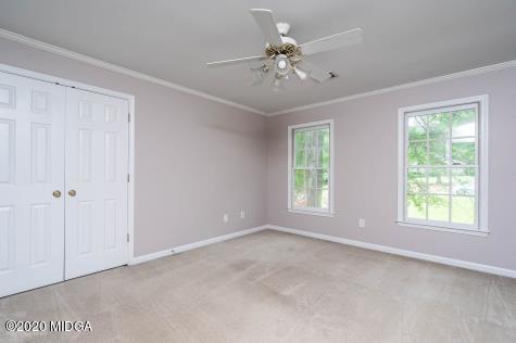 113 Hampton Ridge Road Macon, GA 31220 - Photo 22 of 29 a view of an empty room with chandelier fan and fire place