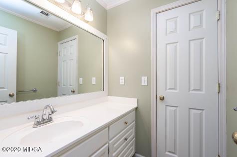 113 Hampton Ridge Road Macon, GA 31220 - Photo 23 of 29 a bathroom with a sink and a mirror