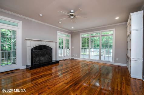 113 Hampton Ridge Road Macon, GA 31220 - Photo 8 of 29 a view of empty room with fireplace and fan