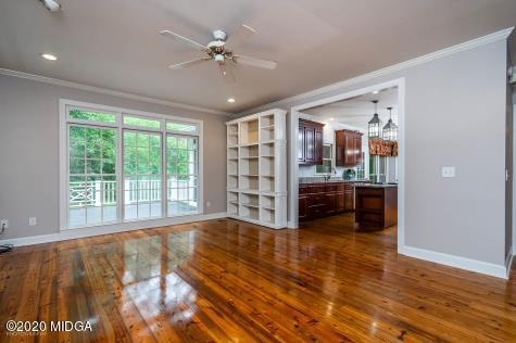 113 Hampton Ridge Road Macon, GA 31220 - Photo 10 of 29 a view of an empty room with window and wooden floor