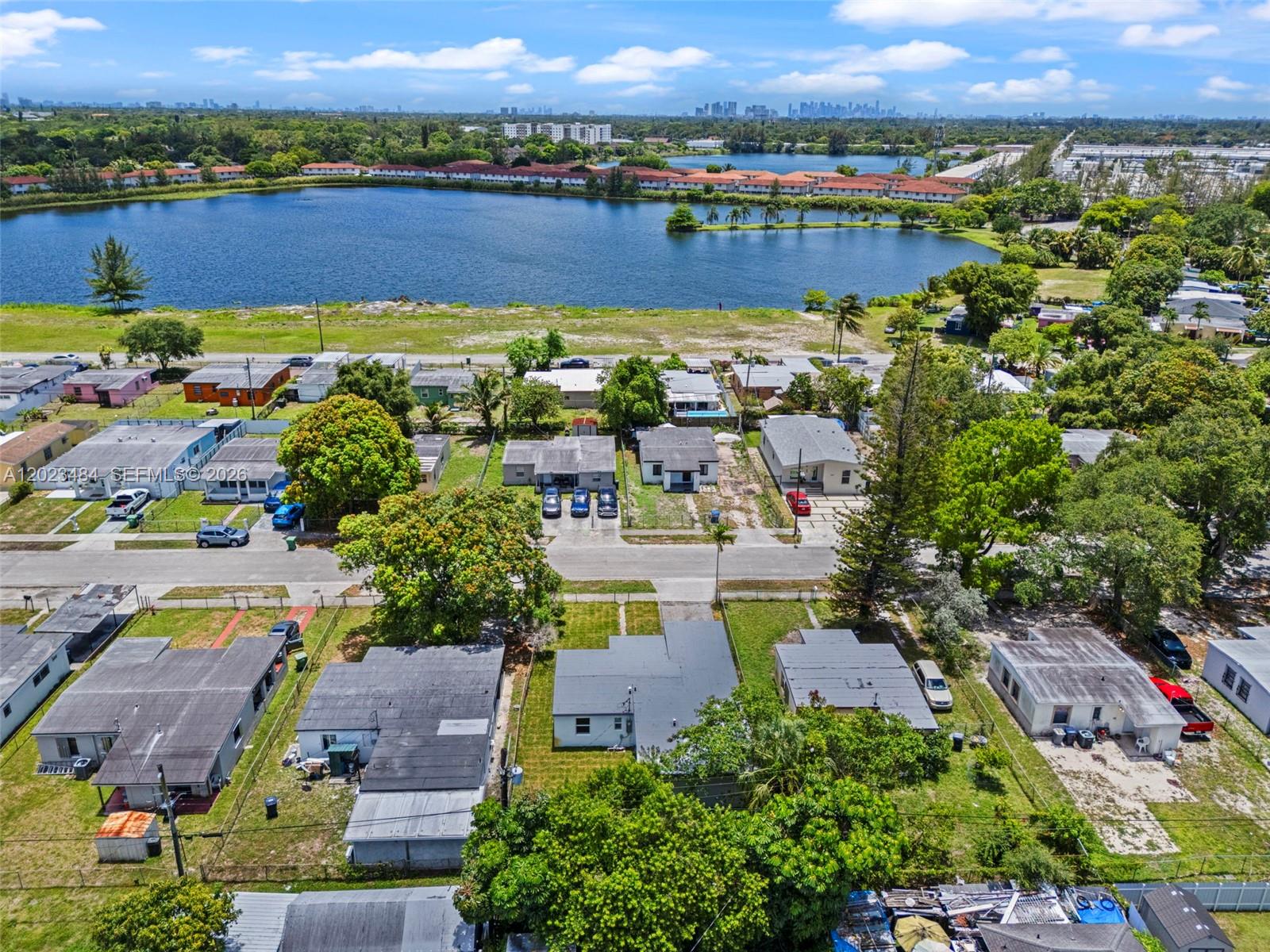 1961 Rutland Street Opa-Locka, FL 33054 - Photo 30 of 33 an aerial view of residential houses with outdoor space and swimming pool