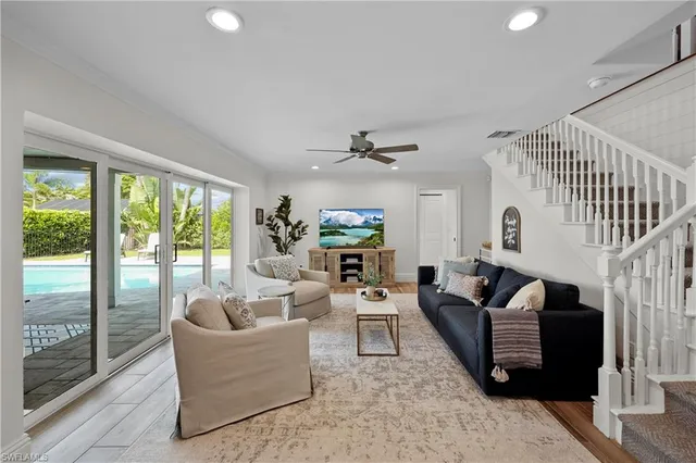 a kitchen with furniture and wooden floor