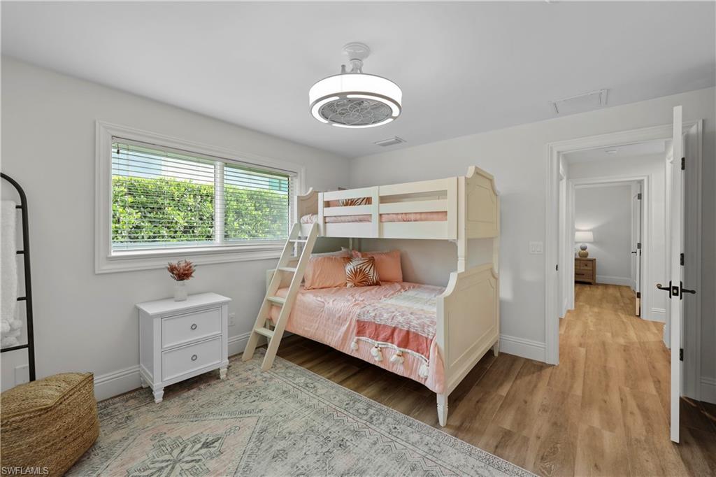 4611 Crayton Road Naples, FL 34103 - Photo 23 of 38 a bedroom with a bed and a window
