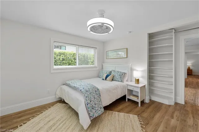a bathroom with a granite countertop sink mirror and a toilet