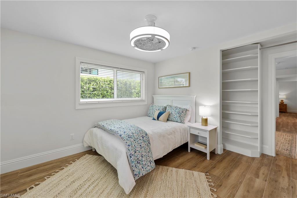 4611 Crayton Road Naples, FL 34103 - Photo 24 of 38 a bedroom with a bed and a window