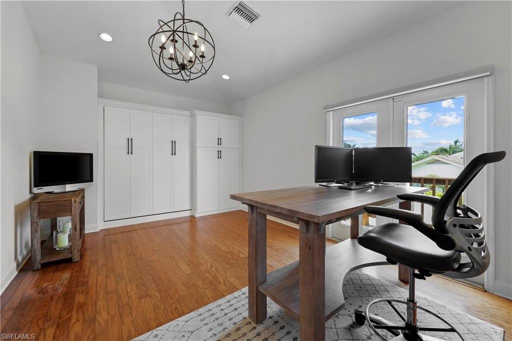 4611 Crayton Road Naples, FL 34103 - Photo 28 of 38 a view of a livingroom with furniture and a flat screen tv