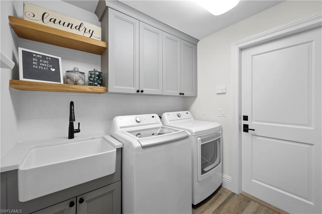 4611 Crayton Road Naples, FL 34103 - Photo 32 of 38 a utility room with dryer and washer