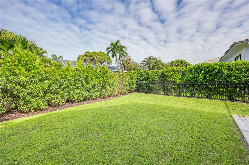4611 Crayton Road Naples, FL 34103 - Photo 37 of 38 a view of a yard with a tree