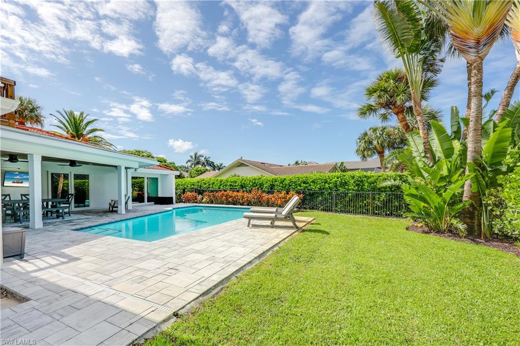 4611 Crayton Road Naples, FL 34103 - Photo 38 of 38 a view of a house with a yard porch and sitting area