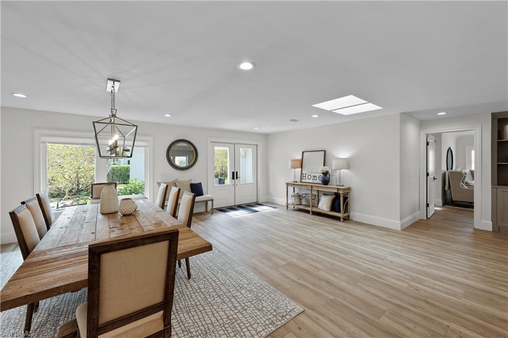 4611 Crayton Road Naples, FL 34103 - Photo 5 of 38 a living room with furniture and a table