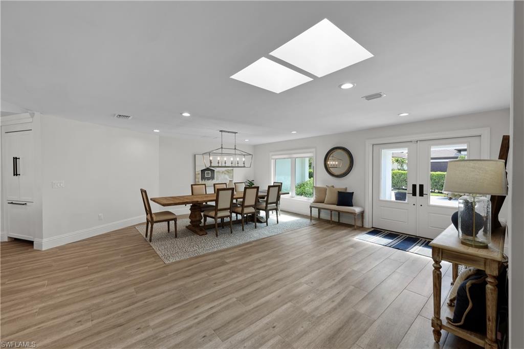4611 Crayton Road Naples, FL 34103 - Photo 6 of 38 a view of a dining room with furniture window and wooden floor