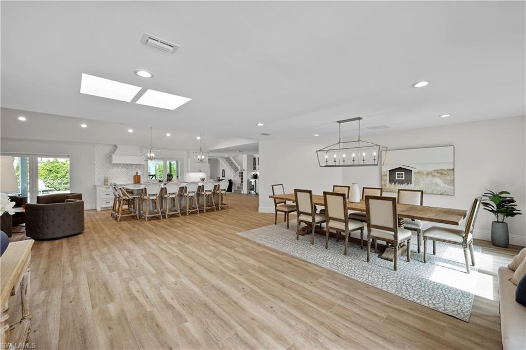 4611 Crayton Road Naples, FL 34103 - Photo 8 of 38 a living room with furniture and a wooden floor