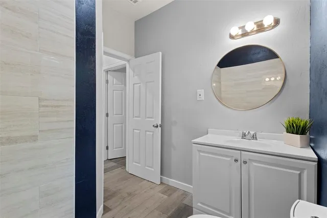 a view of a hallway with two rooms