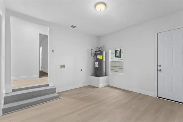 a view of a tree in the middle of a yard