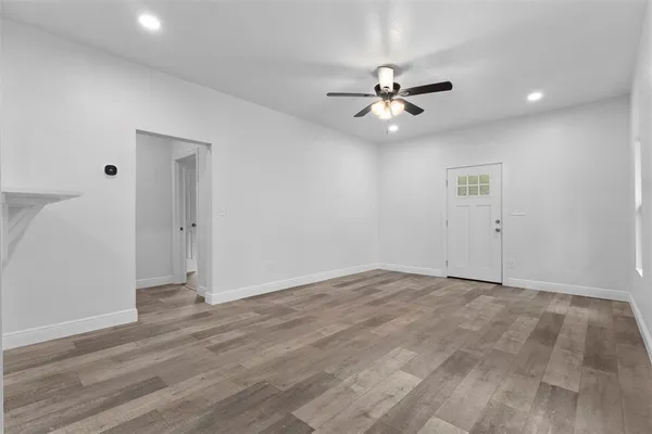 a kitchen with a sink window and cabinets
