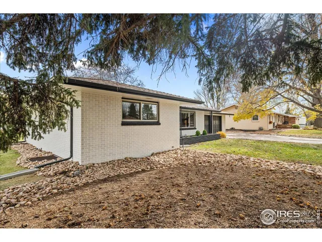 a house with trees in the background