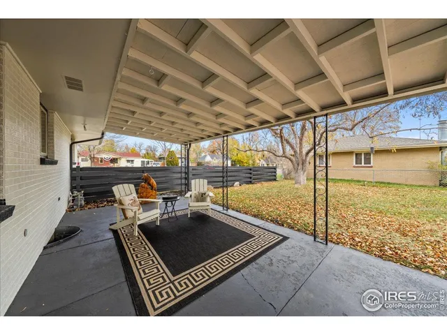 a living room with lots of furniture and a rug