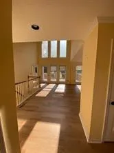 a view of a living room and entryway