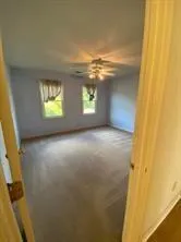 a view of empty room with windows