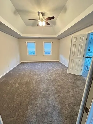 a bathroom with a tub sink and cabinets
