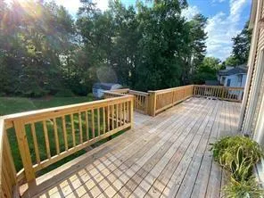 a view of a deck with a yard