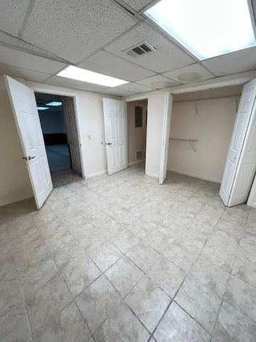 a view of work space with wooden floor and furniture