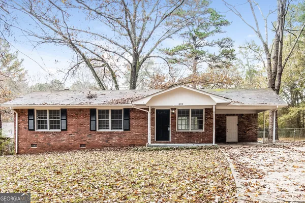 front view of a house with a trees