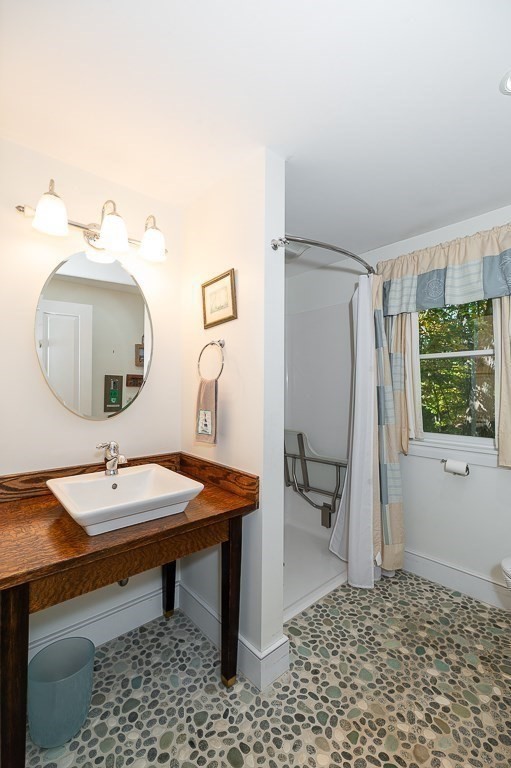 8 Mill Road Ipswich, MA 01938 - Photo 20 of 38 a room with a table and chairs