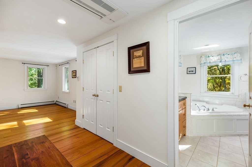 8 Mill Road Ipswich, MA 01938 - Photo 22 of 38 a view of a hallway with windows and entryway