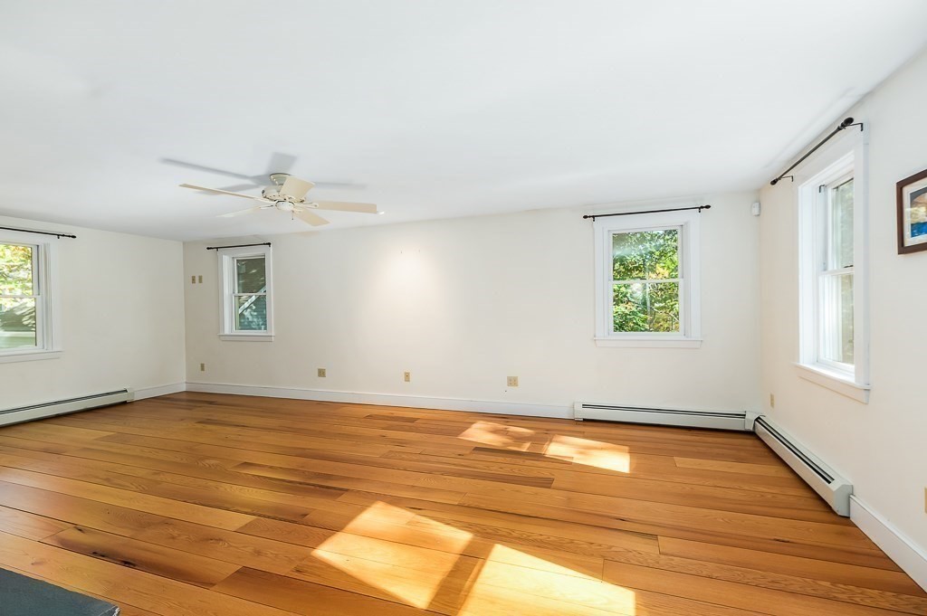 8 Mill Road Ipswich, MA 01938 - Photo 23 of 38 wooden floor in an empty room with a window