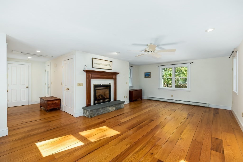 8 Mill Road Ipswich, MA 01938 - Photo 24 of 38 an empty room with windows and fireplace