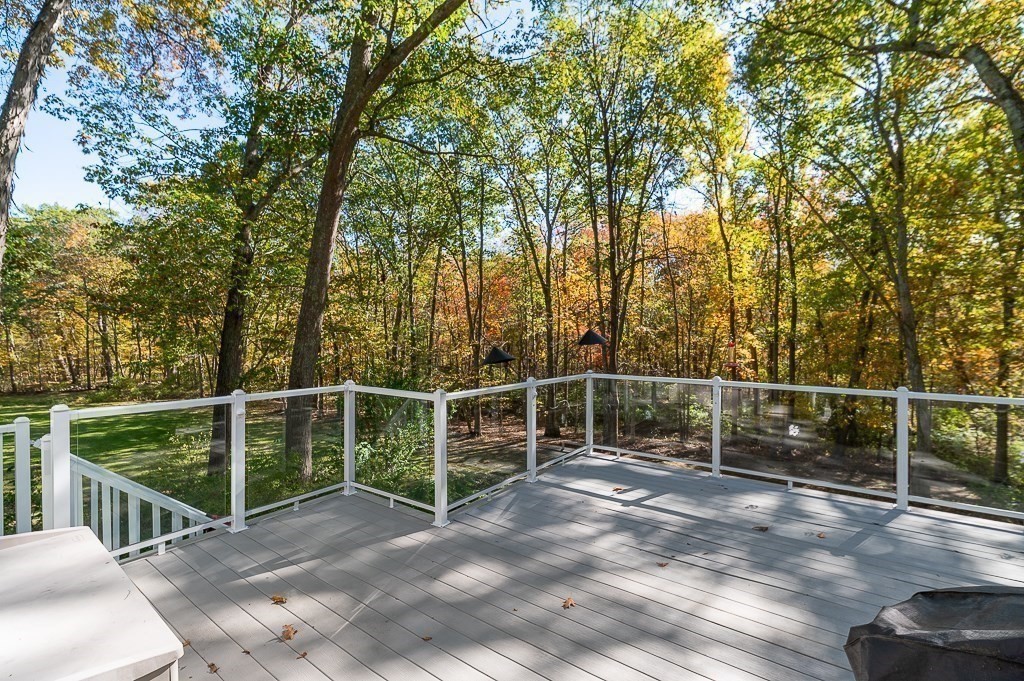8 Mill Road Ipswich, MA 01938 - Photo 28 of 38 a view of a roof deck with wooden floor and fence