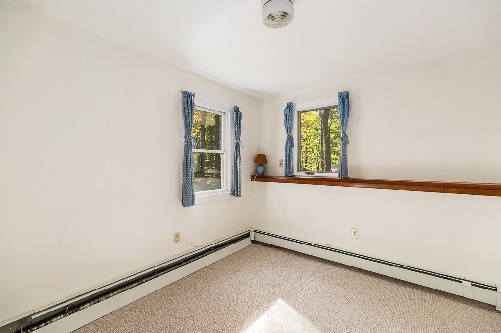 8 Mill Road Ipswich, MA 01938 - Photo 31 of 38 a view of an empty room and window