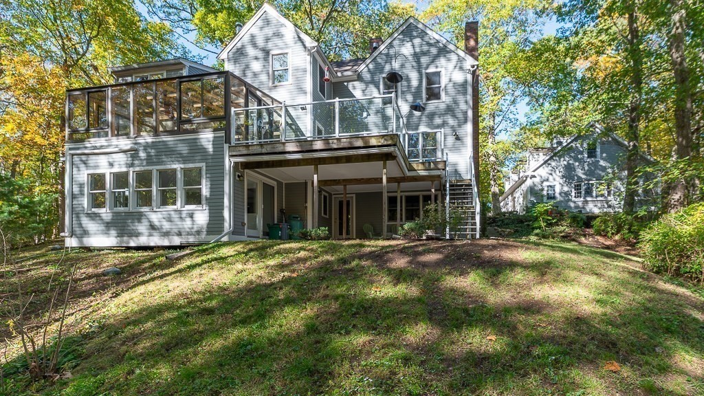 8 Mill Road Ipswich, MA 01938 - Photo 36 of 38 a front view of a house with a garden