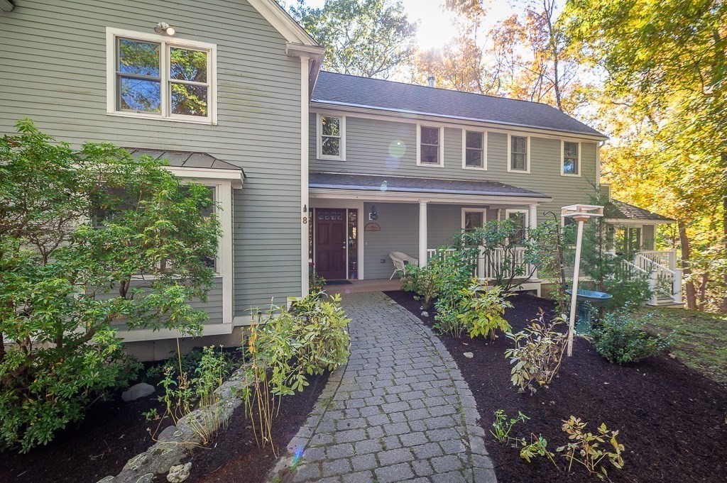 8 Mill Road Ipswich, MA 01938 - Photo 4 of 38 a front view of a house with a yard and potted plants