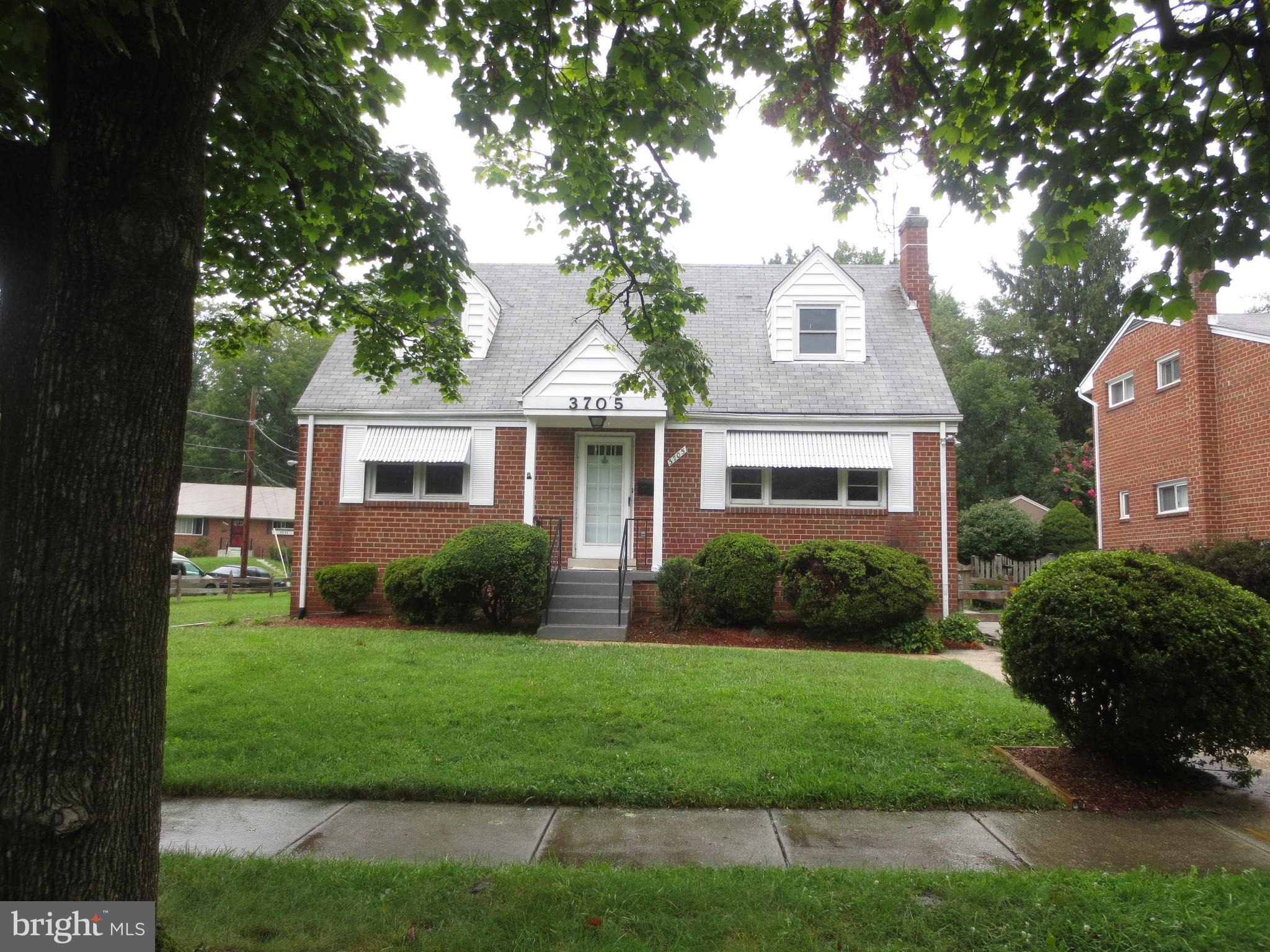 3705 May Street Silver Spring, MD 20906 - Photo 21 of 27 a front view of a house with a yard
