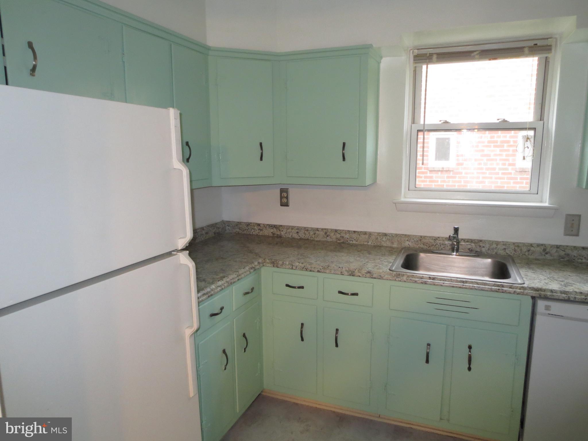 3705 May Street Silver Spring, MD 20906 - Photo 5 of 27 a utility room with cabinets washer and dryer