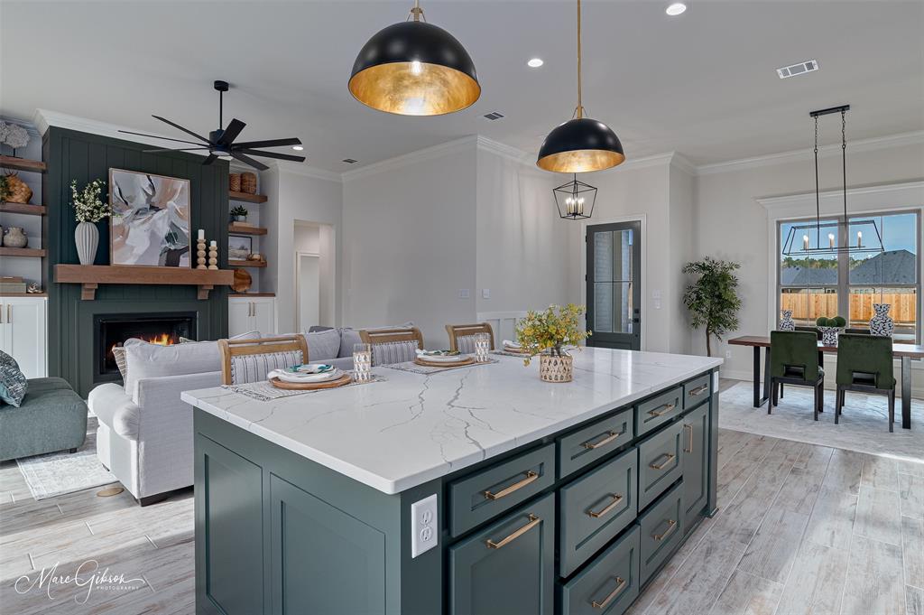 175 Sitka Loop Haughton, LA 71037 - Photo 13 of 28 a view of a dining room and kitchen with a table chairs