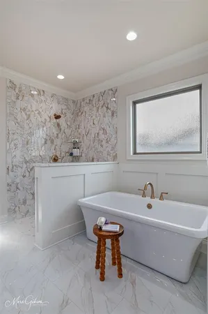 a view of a room that has a bed in it