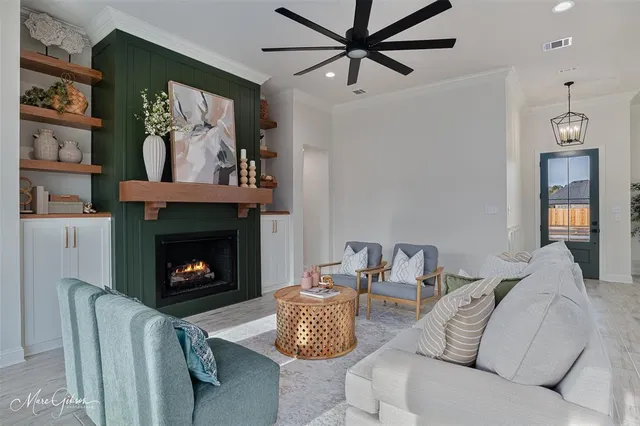 a living room with furniture and a fireplace
