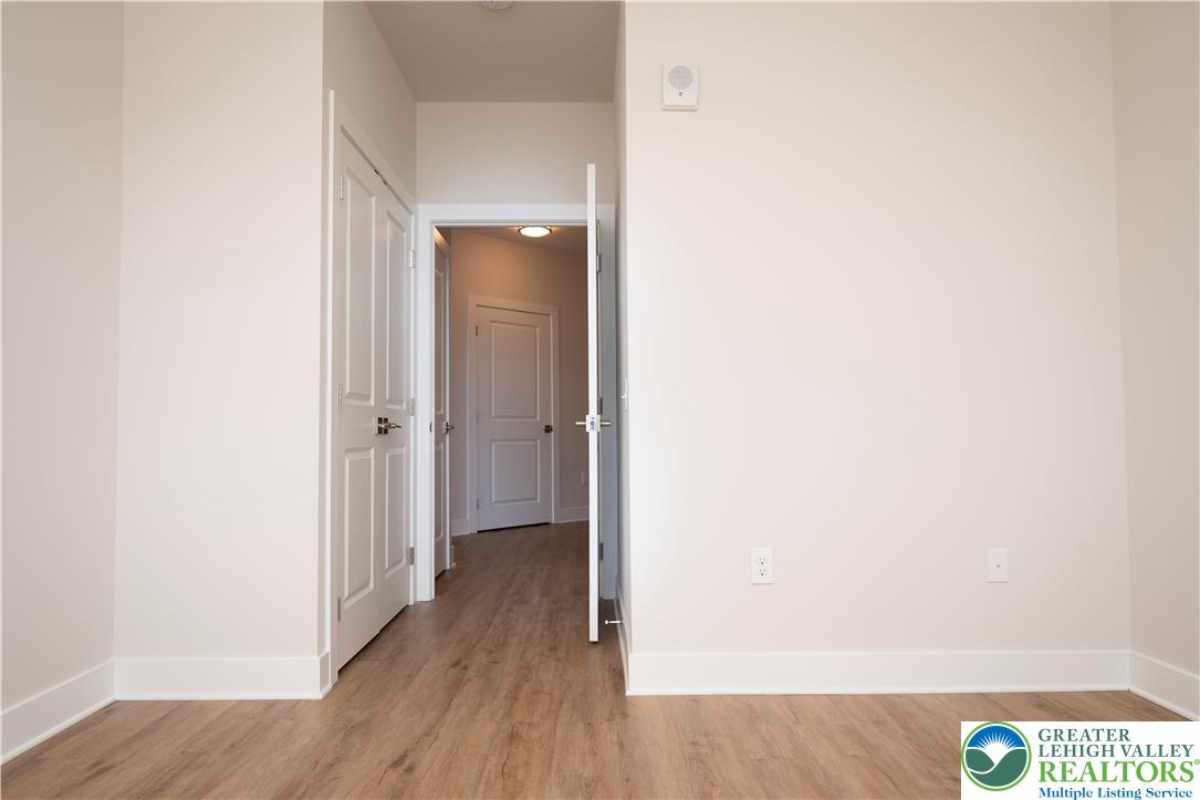 1763 Madison Avenue, Unit 201 Bethlehem, PA 18017 - Photo 12 of 20 a view of a hallway with wooden floor