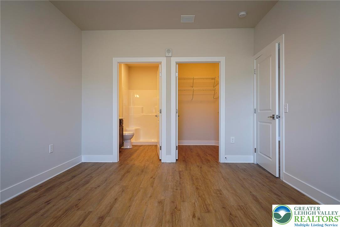 1763 Madison Avenue, Unit 201 Bethlehem, PA 18017 - Photo 15 of 20 wooden floor in an empty room with a window