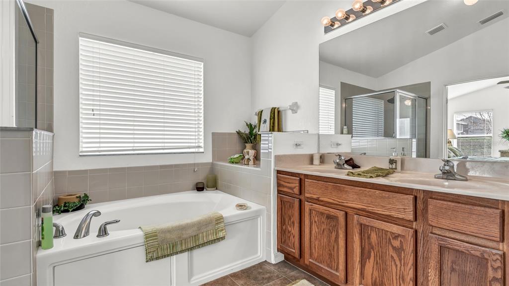 1153 Legatto Loop Dundee, FL 33838 - Photo 25 of 48 a bath room with a sink and a window
