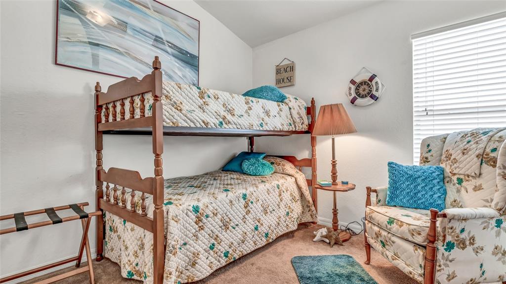 1153 Legatto Loop Dundee, FL 33838 - Photo 26 of 48 a bedroom with a bed and wooden floor